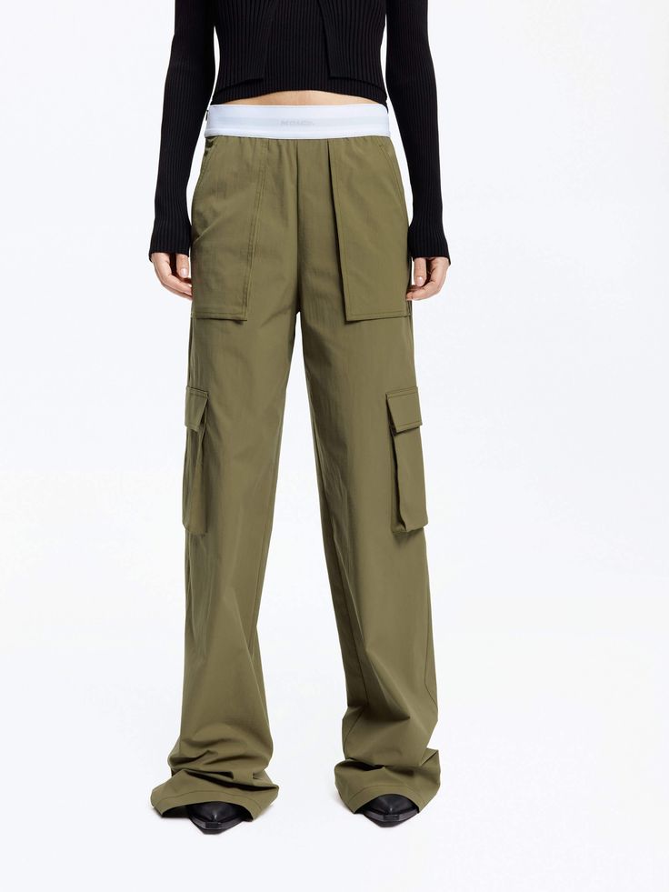 MO&Co. Women's Contrast Waist Cargo Pants Discover the perfect balance of comfort and functionality with our pants. Made with breathable outdoor material, these pants feature a straight-leg design and multiple spacious pockets. The elastic contrast waistband adds a touch of style and customizable fit. Features : - Straight leg in cargo style- Multi wide pockets on the sides- Contrast elasticated waistband, UPF 40+ sun protection Code: MBD1PATK01 & MBD1PAT036The back length of size M is 110cmMATE Sporty Straight Leg Pants With Functional Pockets, Functional Straight Leg Parachute Pants, Functional Cargo Pants With Multiple Pockets For Work, Functional Full Length Pants With Elastic Waistband, Utility Pants With Functional Pockets, Functional Straight Leg Parachute Pants With Cargo Pockets, Functional Wide-leg Cargo Pants With Multiple Pockets, Functional Straight Leg Parachute Pants With Multiple Pockets, Sporty Cargo Pants With Side Pockets For Work