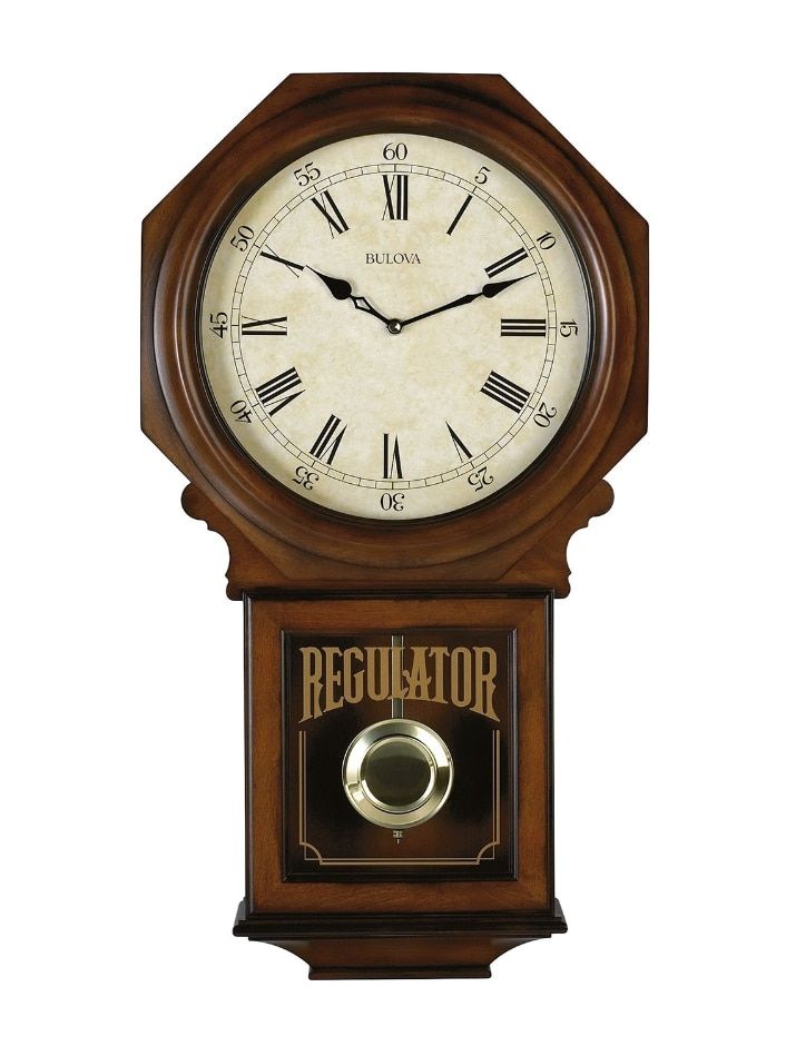 an old fashioned clock with the word regulator on it's front and sides