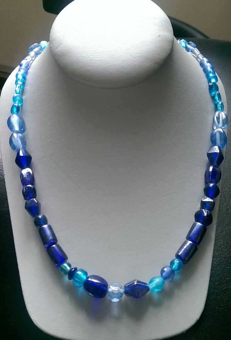 This one-of-a-kind beaded necklace is made with assort blue glass beads. Toggle clasp. Measures 23" long end to end. Blue Oval Beaded Beads, Blue Faceted Oval Beads, Blue Beaded Necklaces With Oval Beads, Adjustable Blue Czech Glass Jewelry, Blue Oval Beads Single Strand, Blue Single Strand Oval Beads, Blue Oval Beaded Necklaces, Blue Oval Single Strand Beads, Blue Polished Glass Bead Jewelry