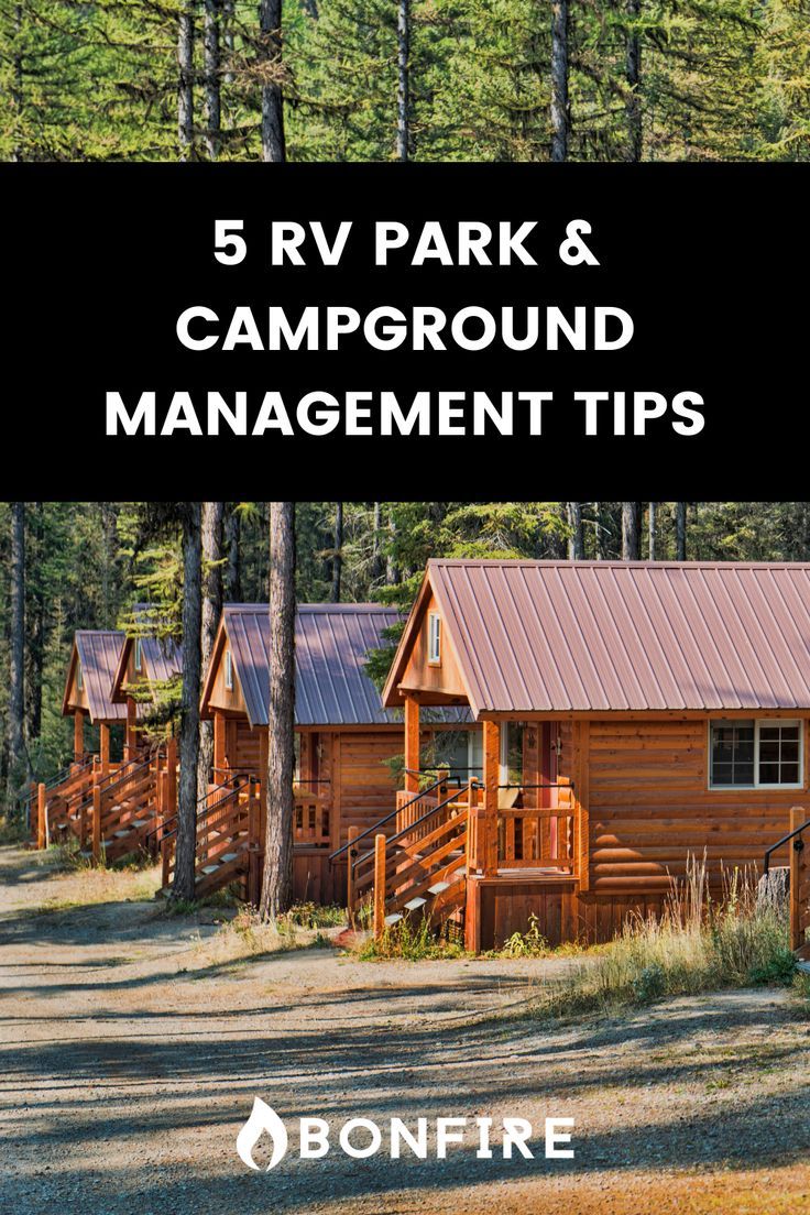 a log cabin surrounded by trees with the words 5 rv park and campground management tips