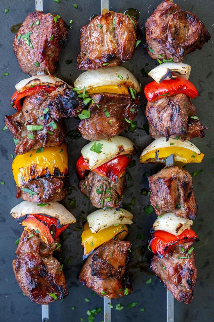 steak kabobs on skewers with peppers and onions