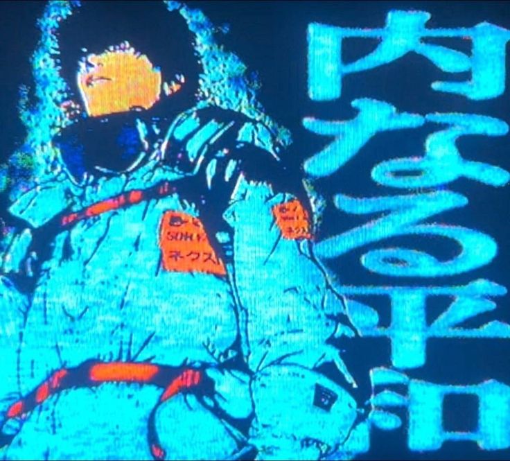 a man in an astronaut suit on a television screen with the words space shuttle printed on it