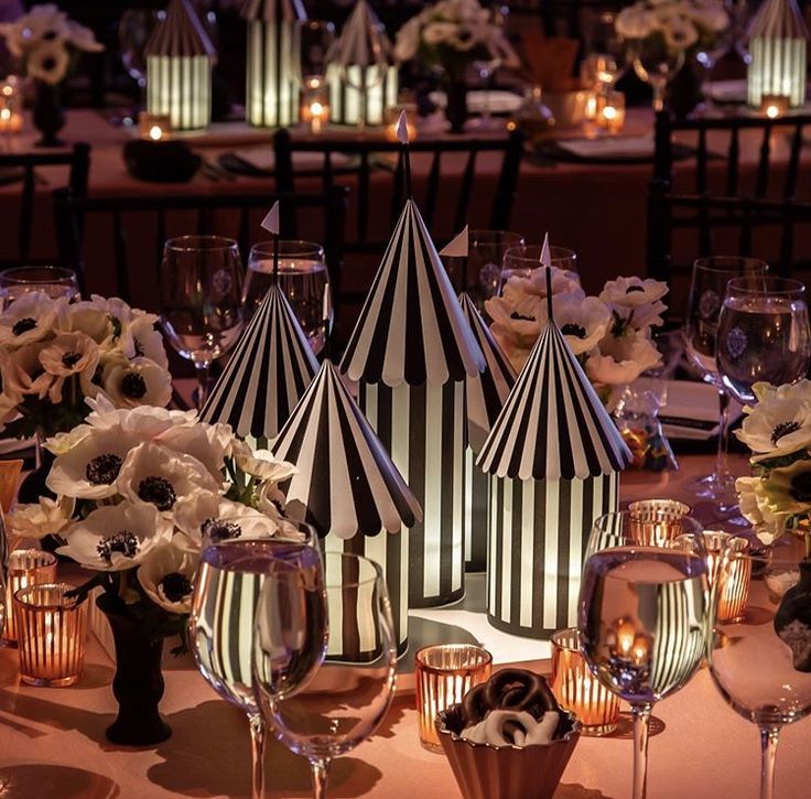 an image of a table setting with flowers and candles