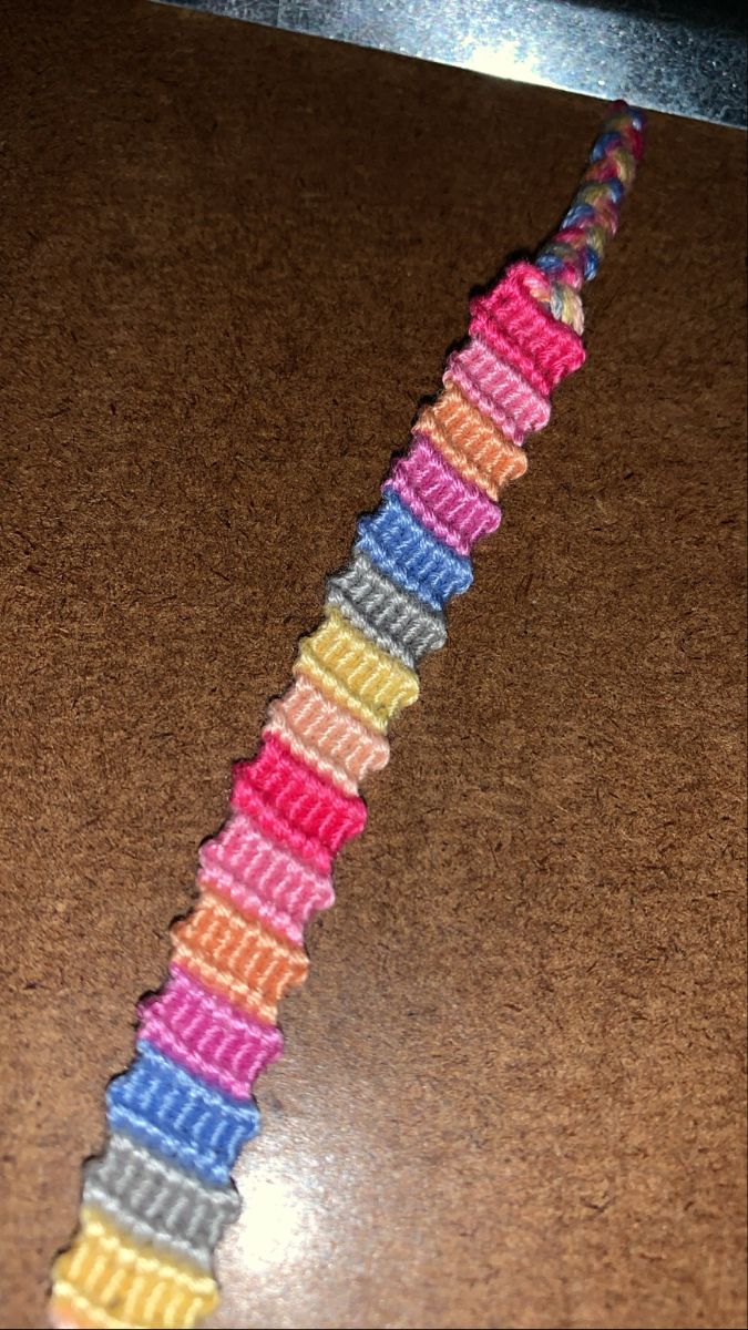 a close up of a colorful ribbon on a table