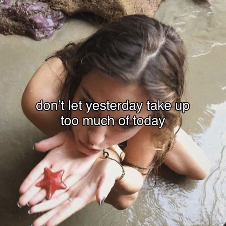 a woman laying in the water with her hand over her face and text that reads, don't let yesterday take up too much of today