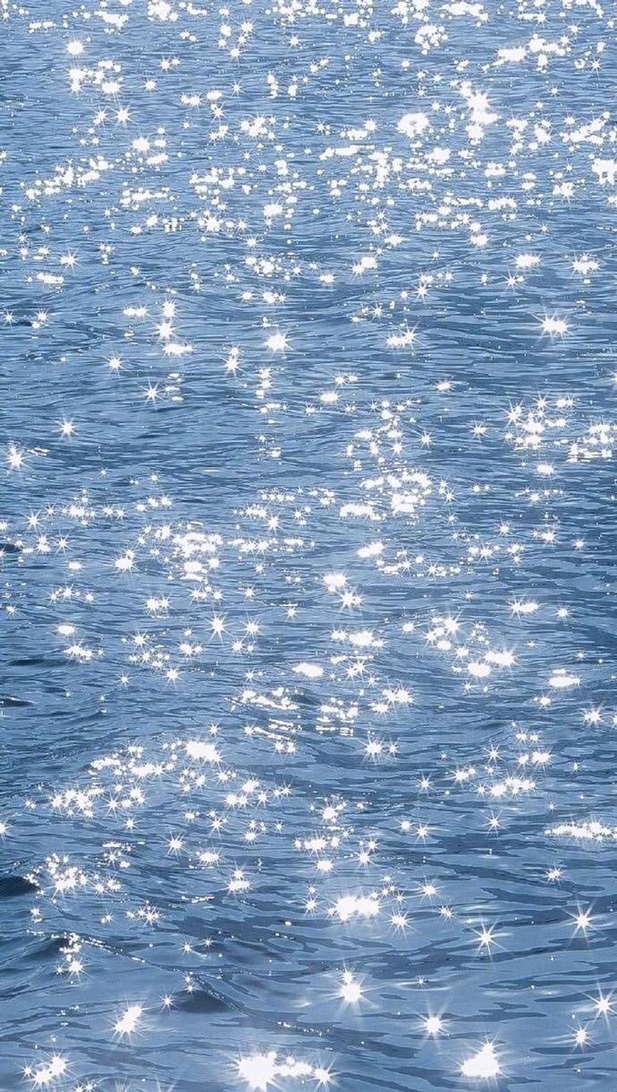 a man riding a surfboard on top of a body of water with stars all over it