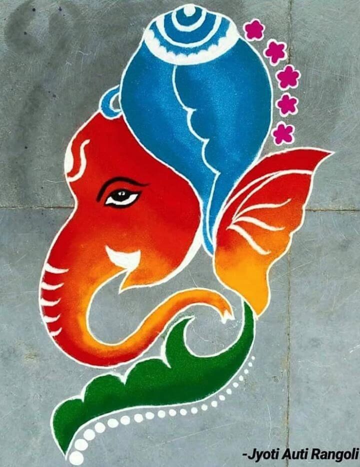 an elephant head painted on the side of a cement wall with flowers and leaves around it