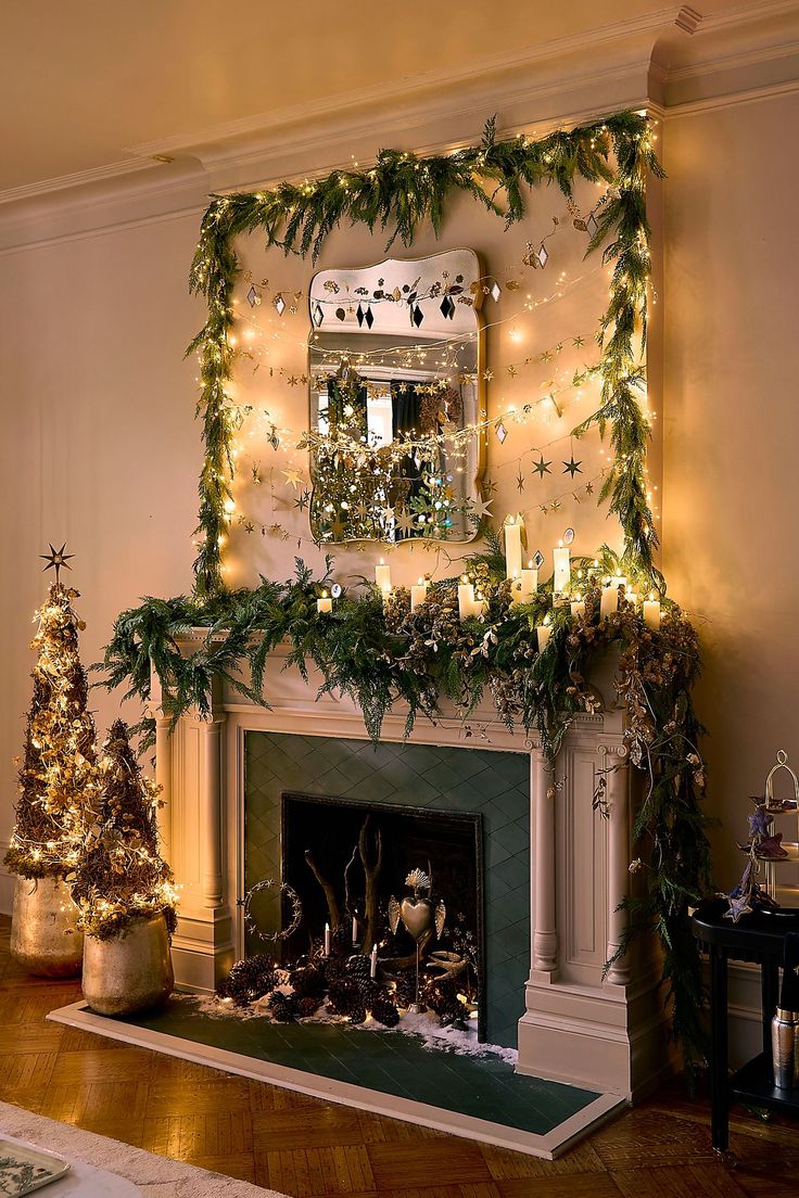 a fireplace decorated with christmas lights and garland