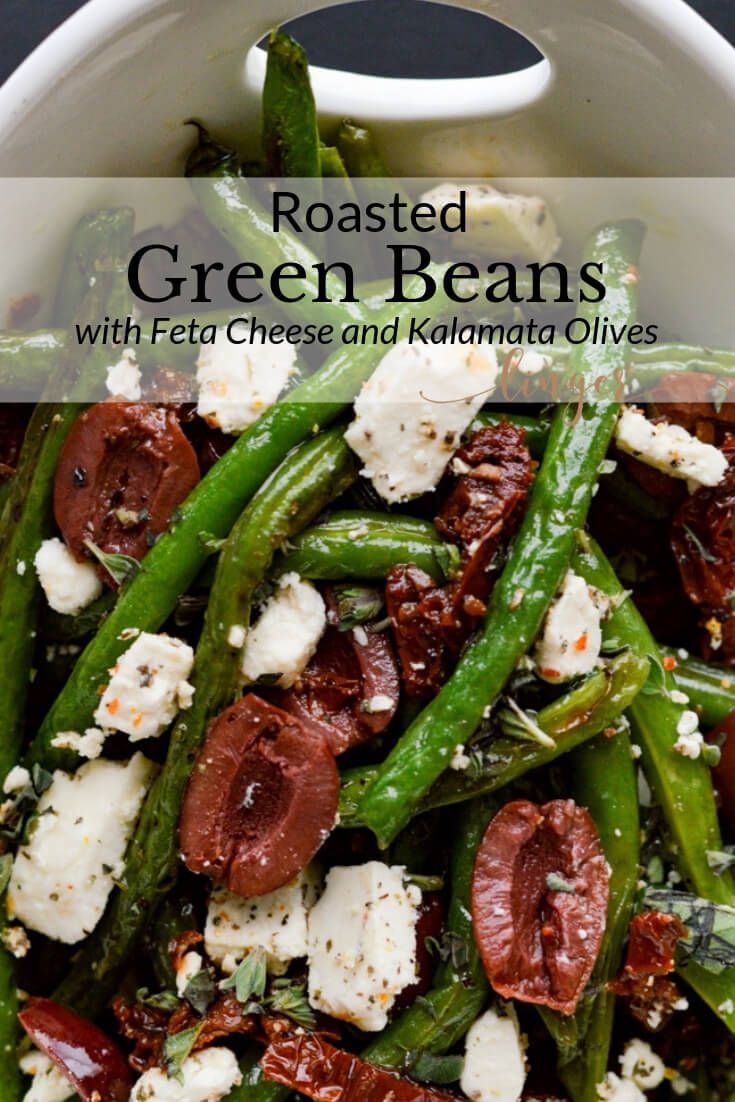 roasted green beans with feta cheese and kalamata olives in a white bowl