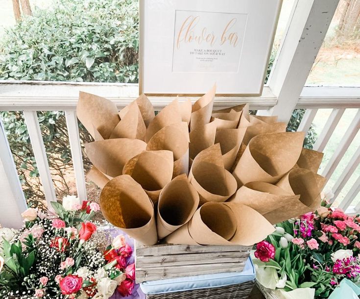 some flowers are sitting on a table outside