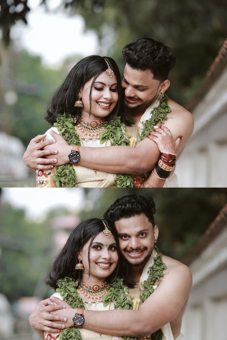 two people hugging each other in front of trees