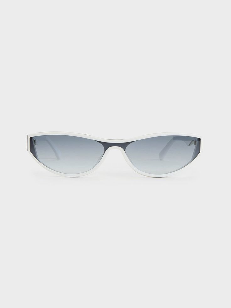 The bold and glamorous shield sunglasses of the 2000s are back. Our version features an understated wraparound design and angular edges that exude a futuristic vibe. Putting a modern twist on the typically oversized eyewear, this pair showcases a smaller and sleeker frame, exuding modern elegance with its refined silhouette. The tinted lenses provide reliable UV protection, creating a striking contrast with the clean white frames for a cool and sleek look. Luxury White Polarized Sunglasses, Cheap White Cat Eye Sunglasses With Gradient Lenses, Luxury Silver Classic Shield Sunglasses, Luxury Silver Chic Sunglasses, Luxury Classic Silver Sunglasses, Luxury Chic Silver Sunglasses, Luxury White Evening Sunglasses, Luxury Optic White Polarized Shield Sunglasses, Luxury Clear Anti-reflective Shield Sunglasses