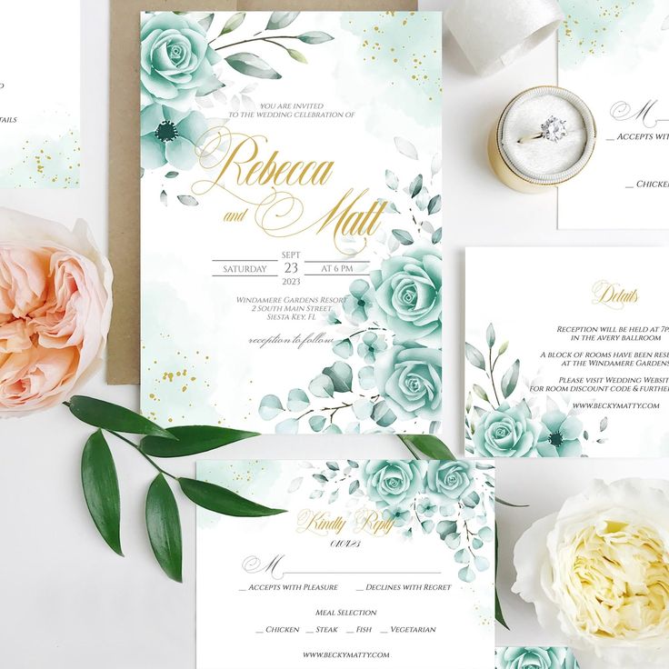 wedding stationery with roses and greenery