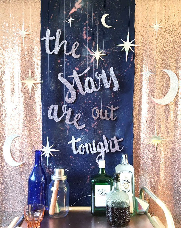 there is a sign that says the stars are out tonight and two bottles next to it