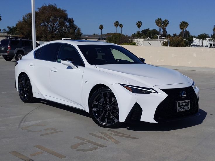 a white car parked in a parking lot