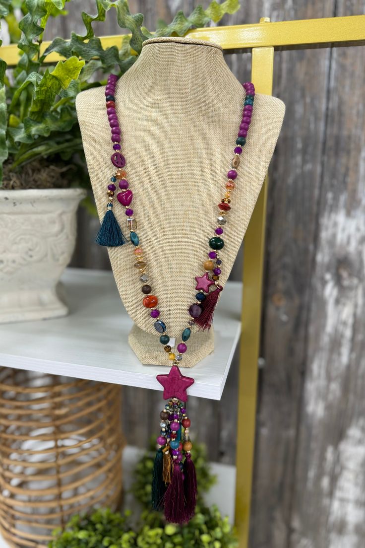 Women's Beaded Necklace Details Average Length 42 Inches Multi Texture/Shape/Color Beads 7" Star Medallion with Beaded Tassels Bead Tassels with Attached Multi Color Thread Tassels Shipping Packages typically ship within 1-3 business days after you place your order, with free shipping on all eligible orders. We’d love to see you in our Jasper, Alabama location, so please stop on by! To be the first to see our newest arrivals, don't forget to join our amazing and fun Facebook Community! You can a Multicolor Star-shaped Adjustable Necklace, Multicolor Wooden Beaded Necklaces For Party, Multicolor Wooden Beads Necklace For Party, Festival Beaded Star Necklaces, Bohemian Star-shaped Beaded Necklaces, Star-shaped Beaded Necklace For Festival, Bohemian Star-shaped Beaded Necklace, Festival Star-shaped Beaded Necklace, Bohemian Multicolor Star-shaped Jewelry