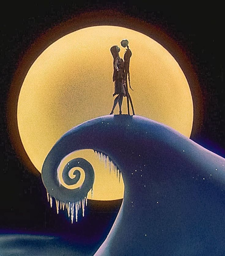 two people standing on top of a wave in front of the moon