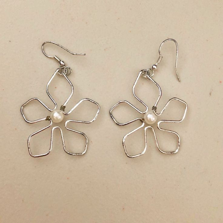 Silver Dangling Flower Earrings With Pearls. Never Worn. Silver Adjustable Flower Earrings For Summer, Dainty Spring Flower Earrings For Pierced Ears, Summer Flower Shaped Metal Earrings, Silver Flower Charm Earrings For Summer, Silver Flower Metal Earrings For Spring, Silver Earrings With Flower Charm For Summer, Silver Metal Flower Earrings For Spring, Trendy Silver Flower Earrings For Pierced Ears, Summer Silver Earrings With Flower Charm