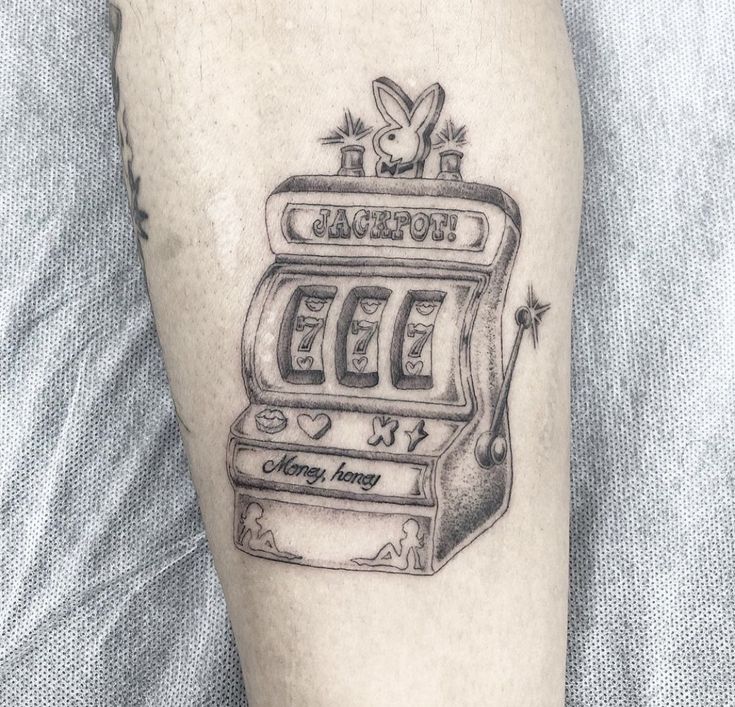 a black and white photo of a slot machine tattoo