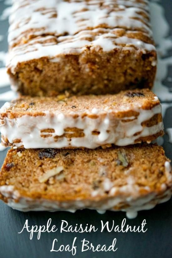 two slices of apple raisin walnut loaf bread with icing and nuts on top