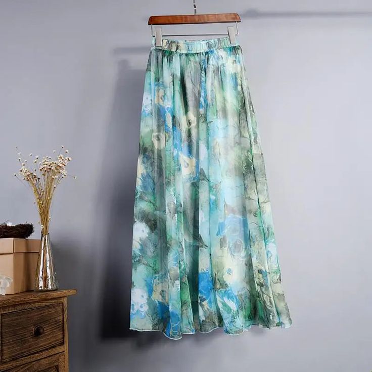 Float through your day in this skirt, where chic meets comfort. Draped in delicate chiffon fabric with a dreamy floral print, this maxi skirt is an enchanting choice for any occasion!! Its lightweight design dances with every step, offering an ethereal grace that's sure to turn heads. Elevate your wardrobe with this elegant essential, perfect for creating moments as unforgettable as its design. Long Chiffon Skirt, Skirt Diy, Printed Long Skirt, Boho Mode, High Waist Long Skirt, White Boho Dress, Mode Boho, Chiffon Floral, Floral Print Chiffon