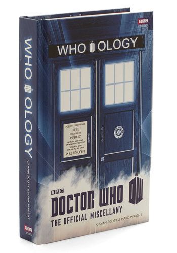 the doctor who book is on display in front of a white background with an image of two doors