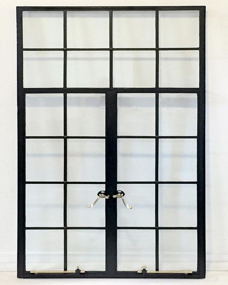 an open window with two handles on each side and glass panes in the middle