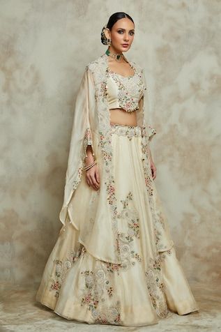 Ivory cape with zardozi, dori embroidered floral vine, paisley motifs highlighted by sequins and pearls. Comes with inner blouse and lehenga. - Aza Fashions Wedding Sets With Gota Work And Cape Sleeves, Wedding Lehenga With Pearl Embroidery And Cape Sleeves, Cape Sleeved Dresses With Gota Work For Weddings, Wedding Dresses With Gota Work And Cape Sleeves, Wedding Dupatta With Gota Work And Cape Sleeves, Cape Lehenga, Kurta Lehenga, Jayanti Reddy, Lehenga Pattern