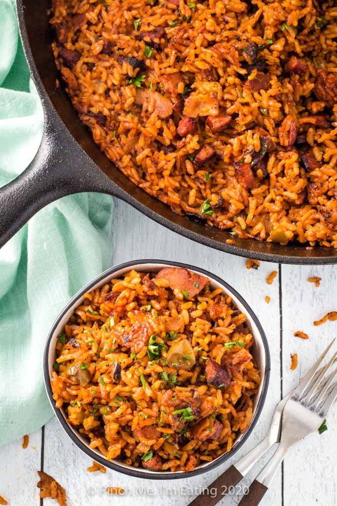 mexican rice in a skillet next to a fork