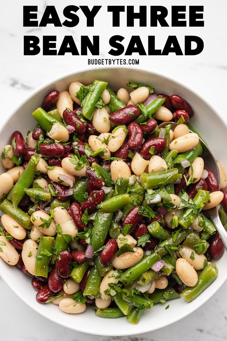 bean salad in a white bowl with the title above it