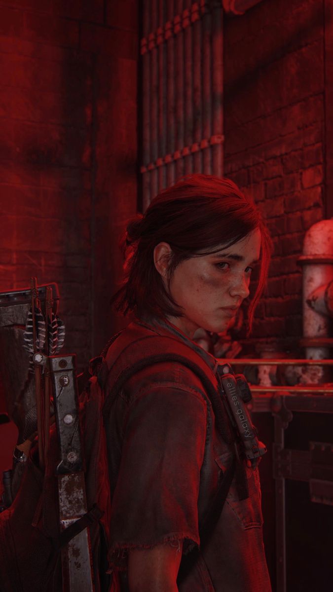 the last of us character standing in front of a brick wall with red light coming from behind