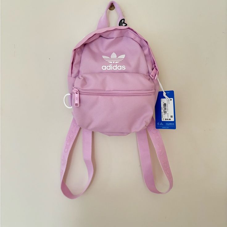 New With Tags Actual Color Is Orchid Fusion Purple But Looks More Of A Pink Shade :) Originally $35 Cute Purple Backpack With Adjustable Strap, Pink Adidas Backpack For Daily Use, Adidas Pink Backpack For Daily Use, Pink Adidas Travel Backpack, Adidas Pink Bags For Everyday Use, Pink Adidas School Backpack, Purple Casual Backpack, Casual Purple Standard Backpack, Casual Purple Bags For Back To School