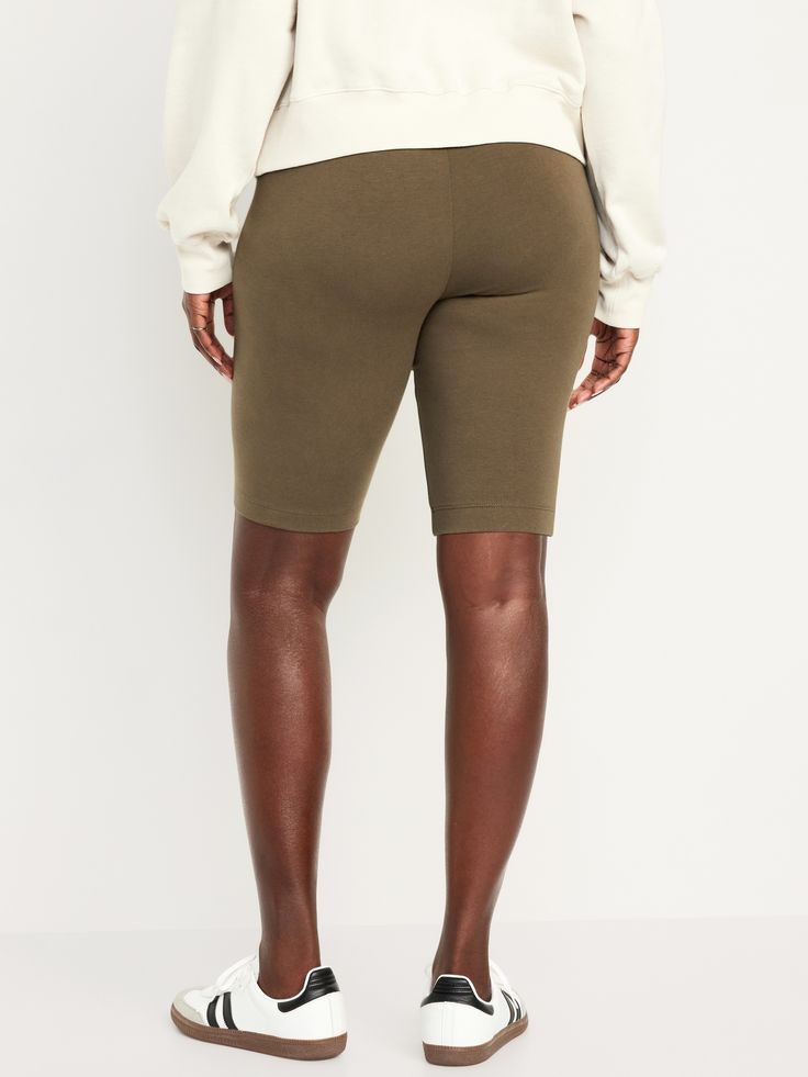 perfect for layering elasticized waistband easy pull-on style online exclusive sits at belly button fitted hip and thigh hits at thigh models are wearing sizes s (4), l (12), and xl (18) Biker Shorts, Petite Size, Belly Button, Old Navy, Layering, High Waisted, Models, Navy, How To Wear