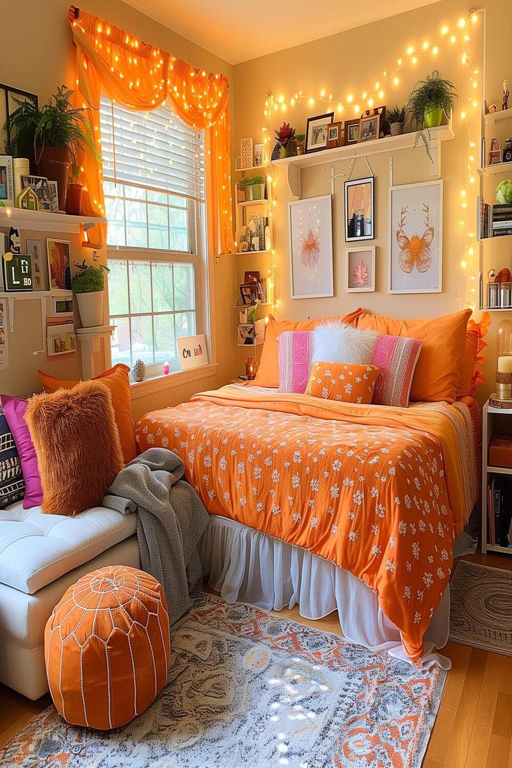 an orange and white bedroom with lights on the wall