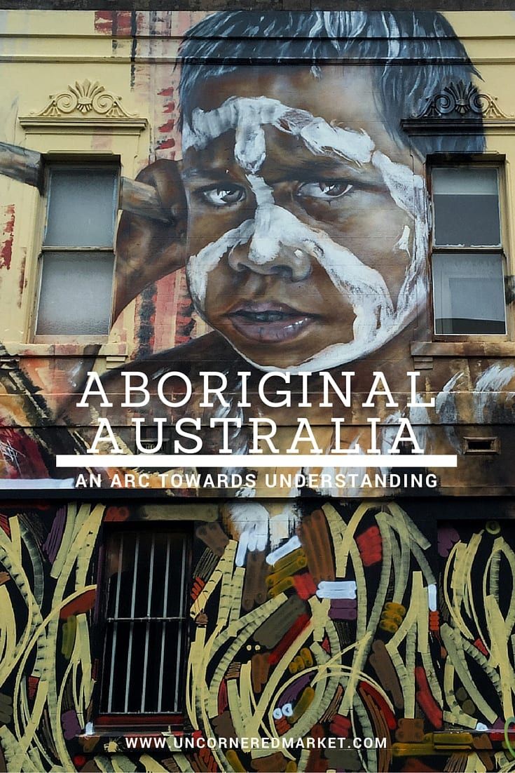 a large mural on the side of a building that says,'aboriginal australia an australian arts and culture standing '