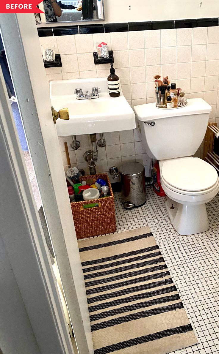 a white toilet sitting next to a sink in a bathroom