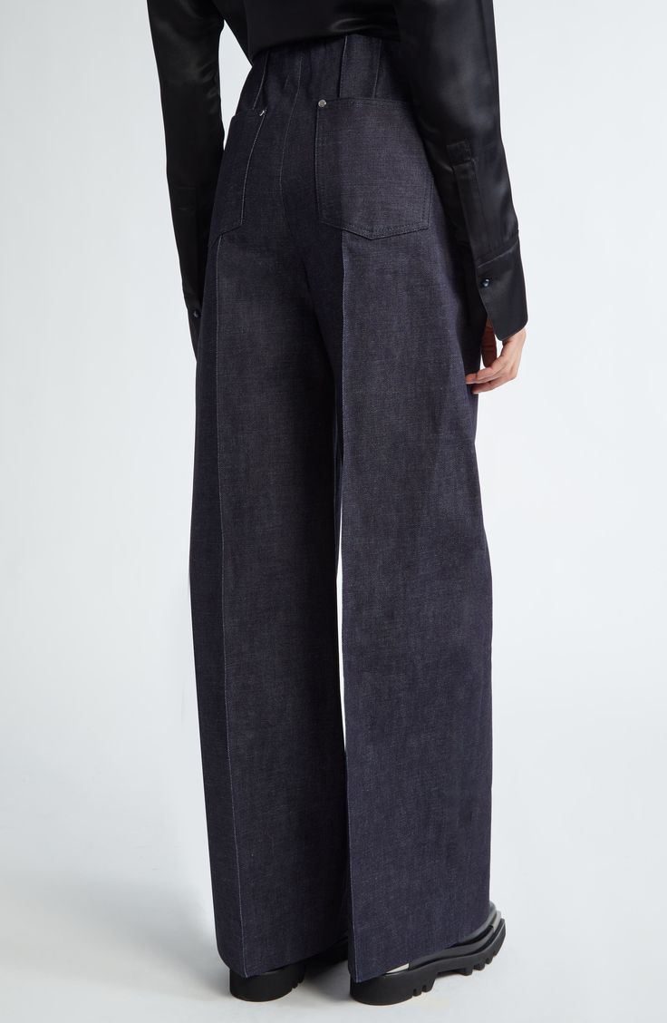 Seen on the designer's spring '24 runway, these nonstretch-denim, Hollywood-waist pants polished with pintucks are tailored in an oversized fit. 32 1/2" inseam; 25" leg opening; 13" front rise; 14 1/2" back rise (size small) Zip fly with hook-and-bar closure Side-seam pockets; back patch pockets 100% cotton Dry clean Made in the USA Designer Clothing Asian & Pacific Islander Owned/Founded Modern Wide Leg Bottoms With Pressed Crease, Chic Wide Leg Formal Jeans, Chic Formal Wide Leg Jeans, Chic Formal Wide-leg Jeans, Modern Denim Workwear Pants, Modern Denim Blue Wide-leg Pants, Modern Denim Pants For Workwear, Modern Wide-leg Denim Blue Pants, Modern Denim Blue Pants For Fall