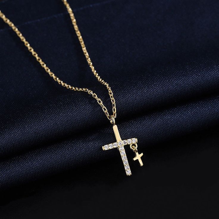 Description & Details The cross is the symbol of today's Christianity, representing love and redemption, a symbol of sanctity and inviolability. For young men and women, wearing a cross necklace often means wishing for happiness, luck, and the protection of angels. • Material: Solid 925 Sterling Silver ∙ Cubic Zirconia• Finish: Hypoallergenic ∙ Gold Plating• Dimensions: 40 - 45 cm chain, adjustable• All our work is custom made by hand with love Spiritual Cross Pendant Clavicle Chain, Spiritual Clavicle Chain Cross Pendant Necklace, Crucifix Cross Necklace With Clavicle Chain As Gift, Spiritual Clavicle Chain With Cross Pendant, Spiritual Clavicle Chain Cross Jewelry, Gift Crucifix Necklace With Clavicle Chain, Spiritual Crucifix Clavicle Chain Jewelry, Gift Cross Pendant Necklace With Clavicle Chain, Gift Cross Necklace With Clavicle Chain