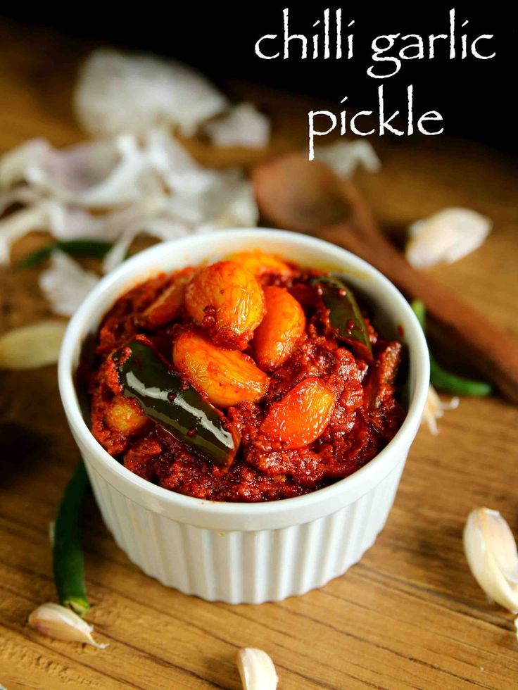 chili garlic pickle in a white bowl on a wooden table