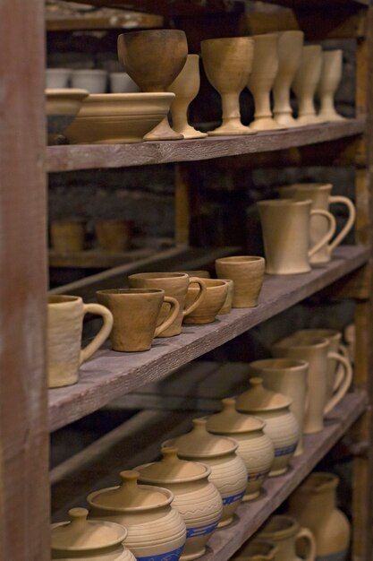 shelves filled with pottery cups and saucers