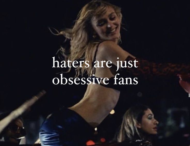 two women are dancing in the dark with words above them that read, haters are just obsesive fans