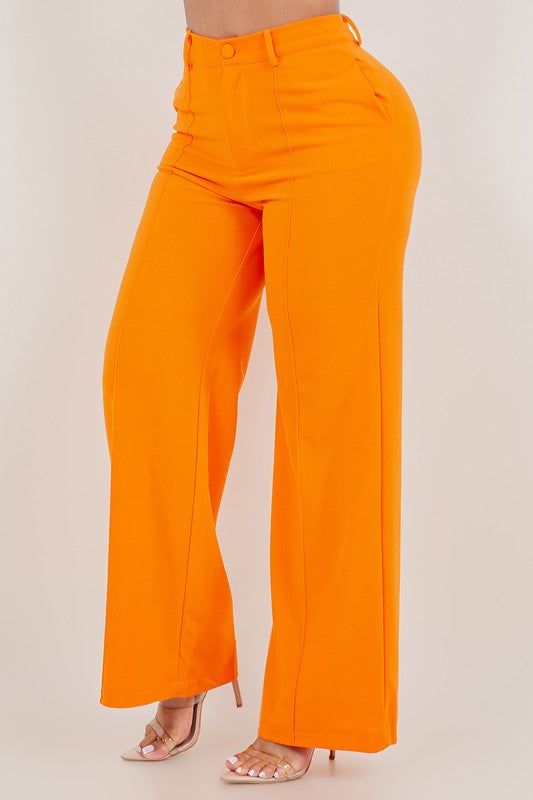 Stand out in style with these vibrant orange pants that are perfect for any occasion. Made from high-quality fabric, these pants offer both comfort and style. Feature 1: High waist design for a flattering fit Feature 2: Front zipper and pockets for added convenience Feature 3: Wide leg for a trendy look Feature 4: Stretchable material for ease of movement Model is wearing a size Large Casual Orange Bottoms, Orange Solid Bottoms For Spring, Trendy Orange Straight Leg Bottoms, Orange Solid Color Bottoms For Spring, Orange Bottoms For Summer, Orange Solid Color Bottoms For Summer, Trendy Orange Straight Leg Pants, Trendy Orange Straight-leg Pants, Orange High-waisted Wide Leg Pants For Fall