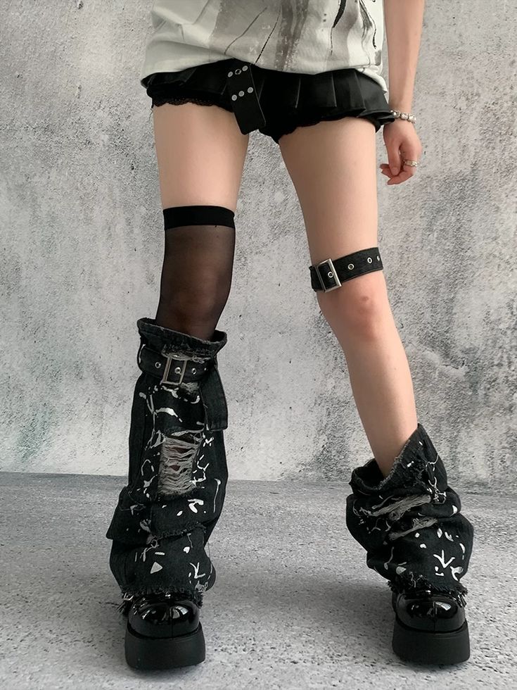 Elevate your edgy style with our black punk distressed holes denim leg sleeves. Crafted from high-quality denim, these leg sleeves are designed to add a rebellious touch to any outfit. Featuring strategically placed distressed holes, they offer a rugged, yet chic vibe perfect for any punk-inspired ensemble.  The versatile black color makes them easy to pair with a variety of tops and accessories, while the distressed detailing ensures you stand out in any crowd. Whether you're hitting the street Black Ripped Punk Bottoms, Black Thigh-high Leg Warmers For Streetwear, Black Thigh High Leg Warmers For Streetwear, Black Distressed Gothic Bottoms, Alternative Style Ripped Black Bottoms, Gothic Black Distressed Bottoms, Alternative Ripped Bottoms For Streetwear, Alternative Style Ripped Bottoms For Streetwear, Trendy Black Leg Warmers For Cosplay