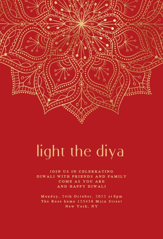 a red and gold christmas card with the words light the diya