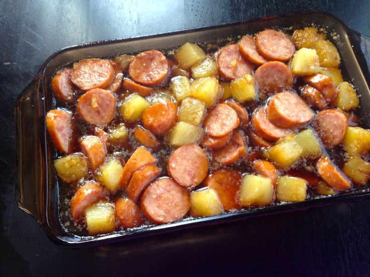 a casserole dish with sausage and potatoes