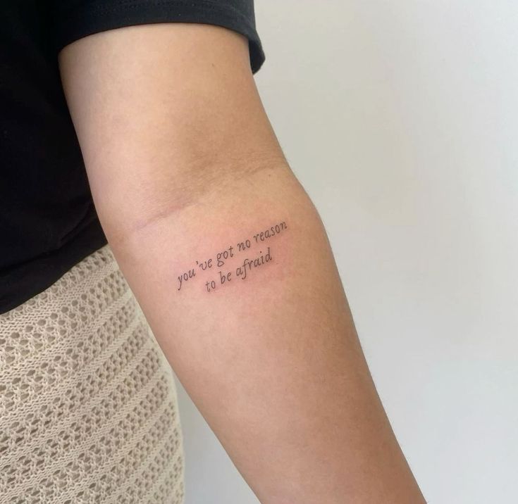 a woman's arm with a tattoo saying you can't go to heaven so be my friend