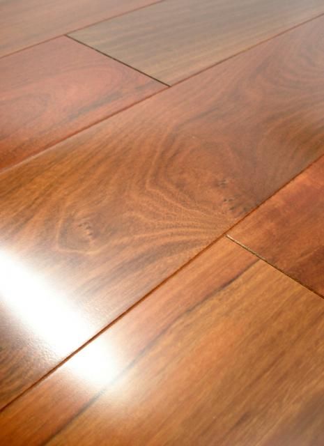 a close up view of wood flooring with the light shining on it