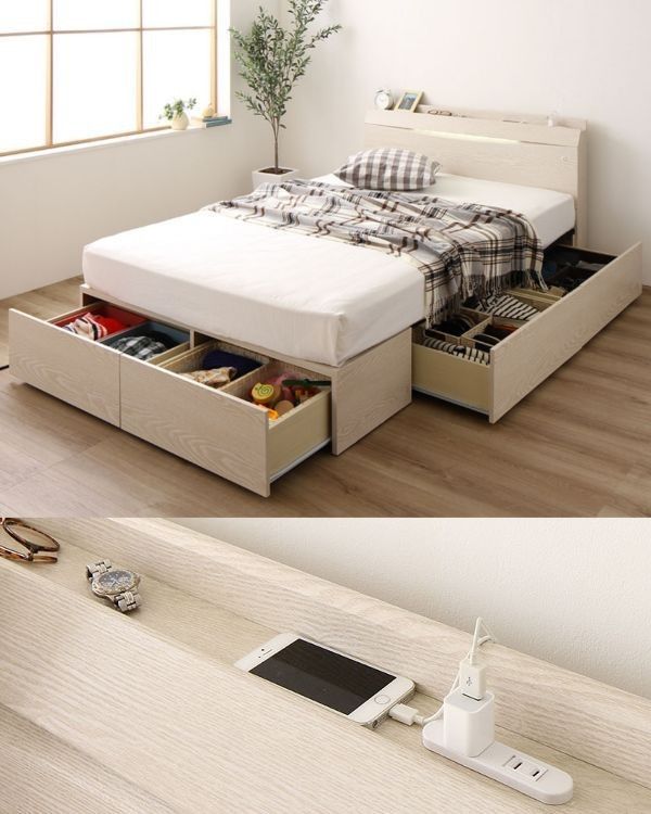 a bed with drawers underneath it and an open drawer under the bed in front of it