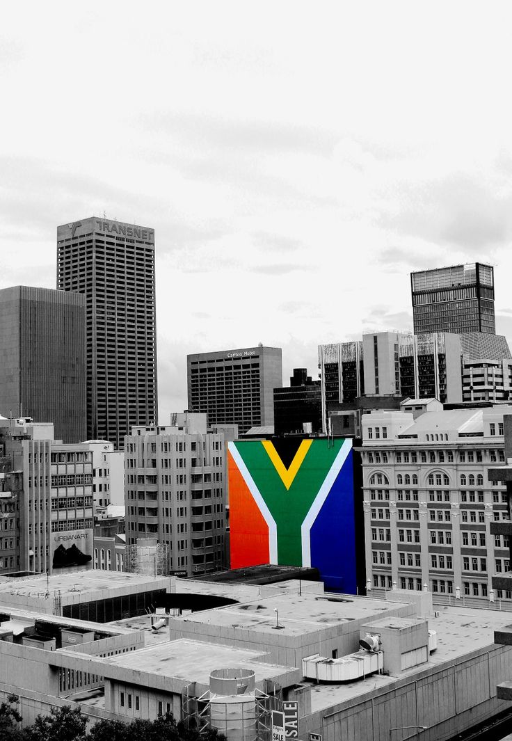 a black and white photo of a city with buildings