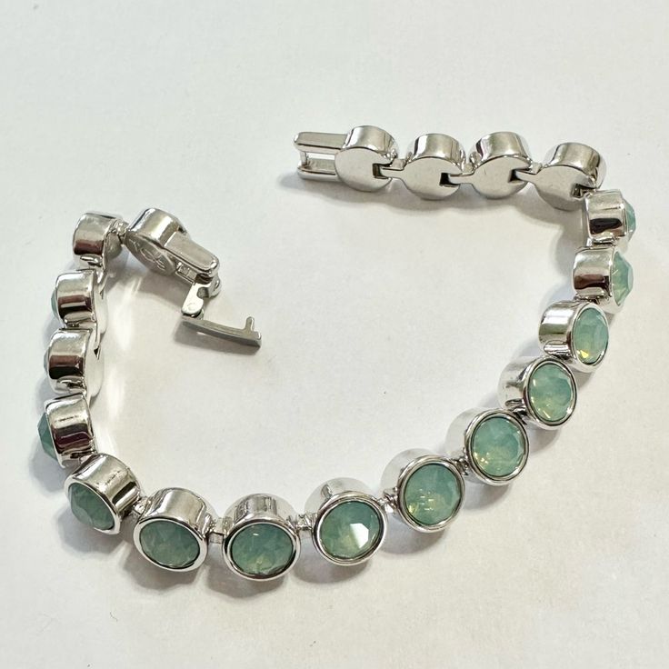 Brand New - Not In Original Packaging. Touchstone Crystal By Swarovski Ice Bracelet. Once Featured On Oprah’s Favorite Items. Foldover Clasp. Rhodium Plating. Green/Sage Tone Crystals Silver Crystal Metal Bracelet With Stones, Silver Metal Crystal Bracelet With Stones, Silver Crystal Bracelet With Stones, Green Gemstone Bracelets In Cubic Zirconia, Green Crystal Bracelet With Rhinestones, Green Cubic Zirconia Crystal Bracelet, Ice Bracelet, Luxury Green Gemstone Sterling Silver Bracelet, Green Hand-strung Crystal Bracelet